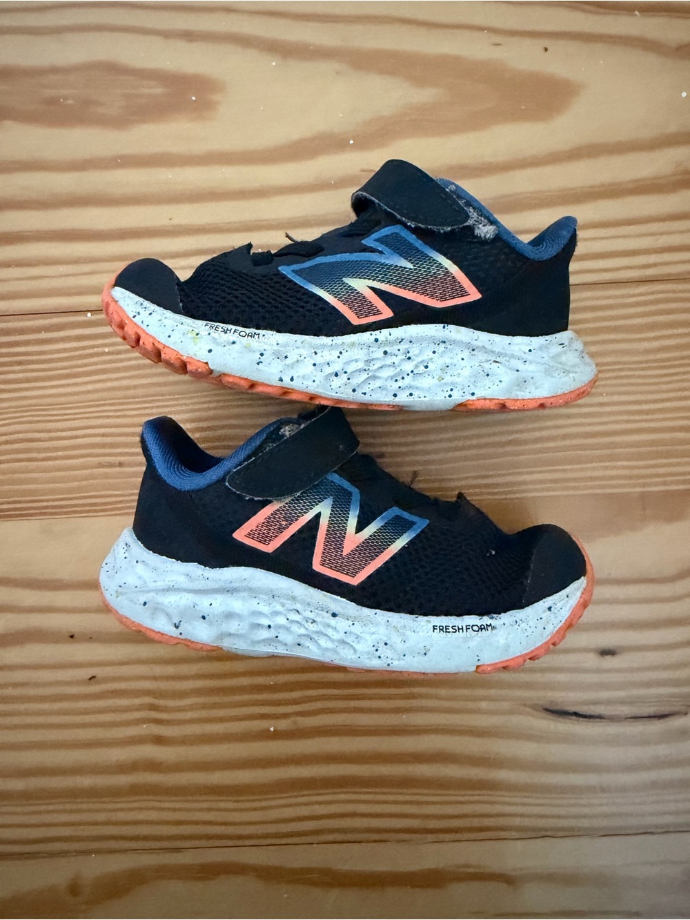 New Balance Kids Black Sneakers with Coral Accents